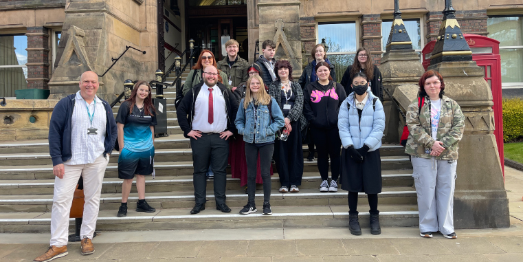 Picture of our Graphic Design students outside of the townhall